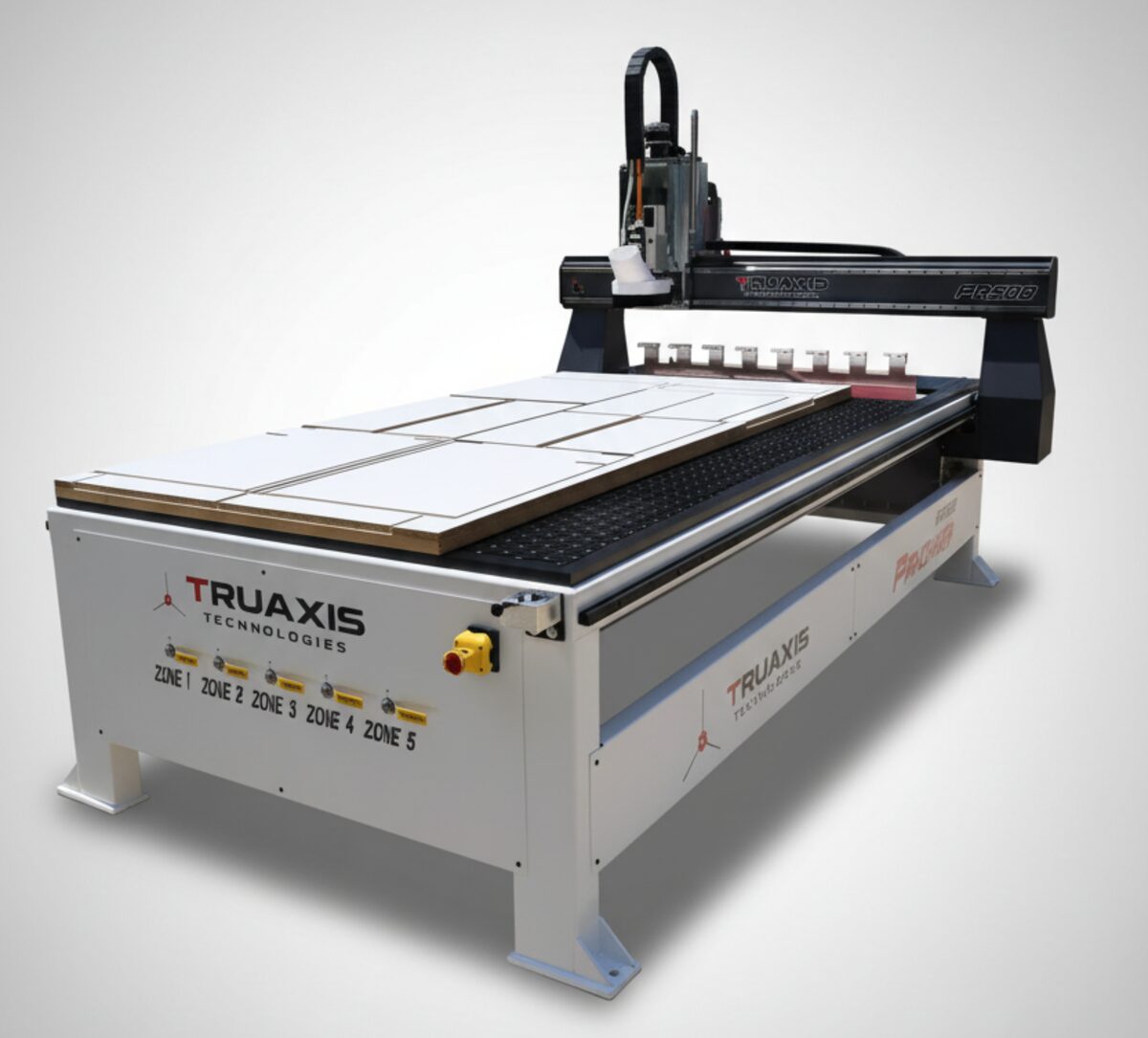 TruAxis Panther CNC router seen from the front left, with sheet material loaded on a five-zone vacuum table.